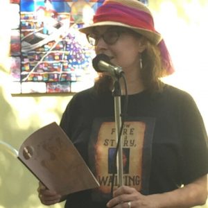 photo of Maria Kelson reading a book